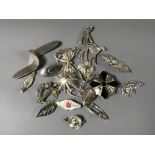 A collection of silver brooches (Q)