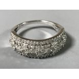 A diamond half eternity ring, approximately 1ct, colour G-H, Clarity I1 I2, size N,