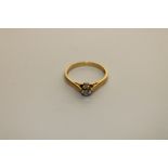 An 18ct gold diamond solitaire ring, approximately 0.25ct, size M.