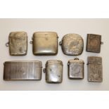 A collection of silver vesta cases and a card case CONDITION REPORT: Most pieces