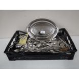 A silver plated lidded entree dish together with a basket of a large quantity of plated flatware