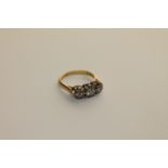 A three stone diamond ring set in 18ct gold