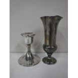 A loaded silver trumpet vase together with a loaded silver dwarf candlestick