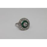 An emerald and diamond cluster ring,