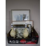 A box containing assorted framed prints and pictures, including a framed watercolour farm scene,