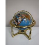 A gemstone globe on stand