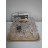 A tray containing assorted lead crystal glassware, including Edinburgh Crystal whiskey tumblers,