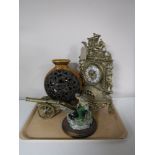 A tray containing a brass French style mantel clock, together with a brass cannon,