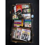 Four boxes containing books and magazines including reference books, antique guides, Private Eye,