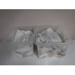 Two boxes of antique christening gowns and table linen