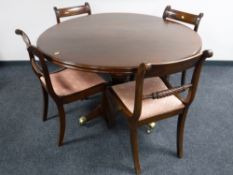 A circular Victorian mahogany pedestal dining table,