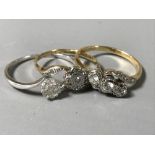 Two 18ct white gold diamond set rings, 4.4g, together with a 9ct diamond cluster ring.
