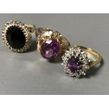 Three gold rings - An 18ct gold pink stone ring 4.9g, an 18ct gold amethyst and diamond cluster 4.