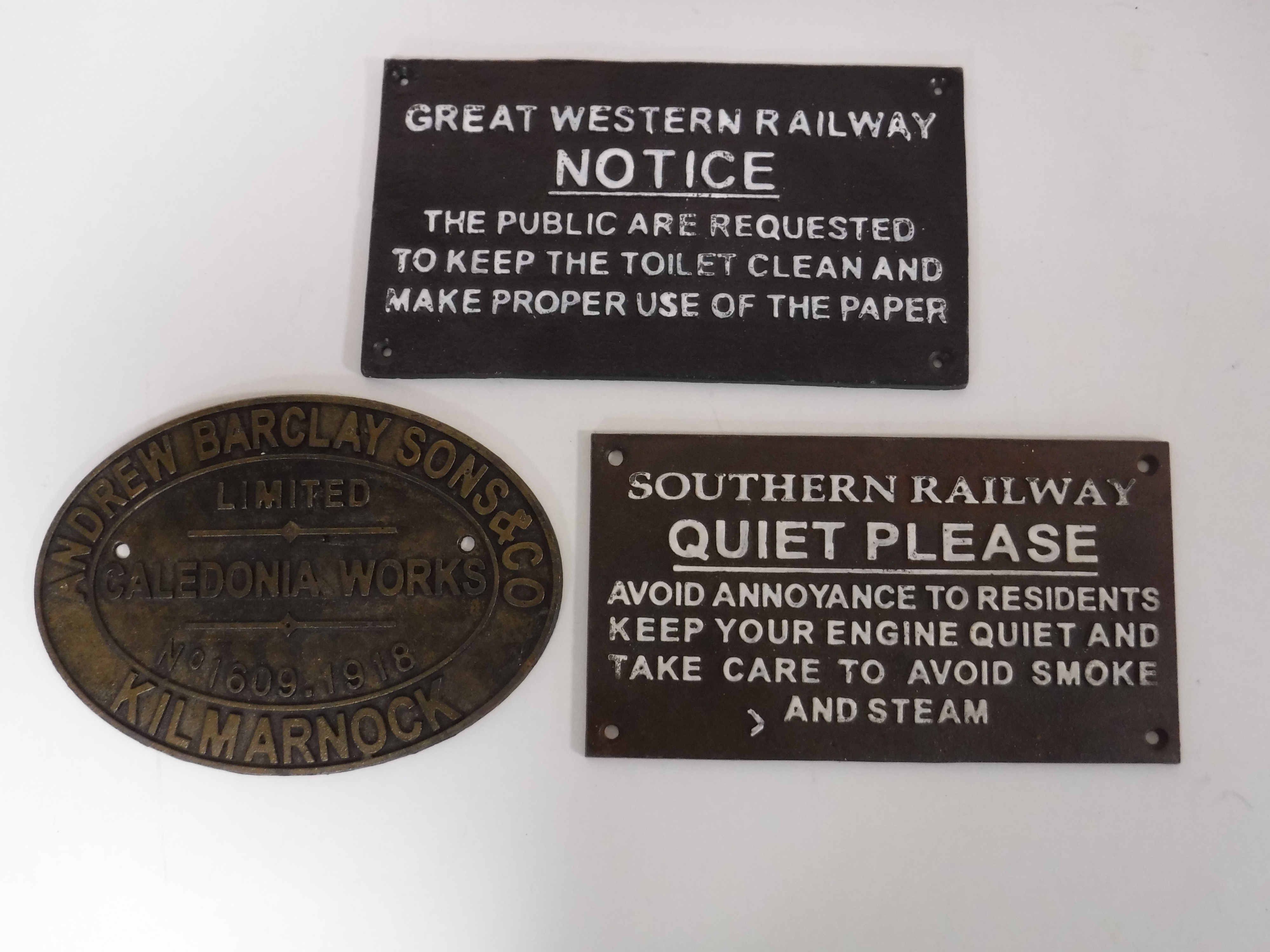 Three cast iron railway plaques and notices