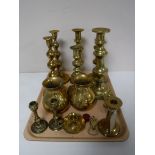 A tray containing a large quantity of brass ware including candlesticks, pair of vases,