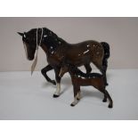 Two Beswick figures, foal and horse with front foot raised,
