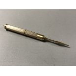 A 9ct gold propelling tooth pick, 6.6g.
