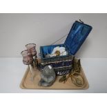 A tray containing brass ornaments, vintage sewing box, glass skull plate,