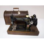 An oak cased vintage Singer sewing machine