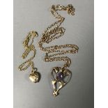 A 9ct gold Victorian pendant on chain together with a 9ct gold heart on chain.