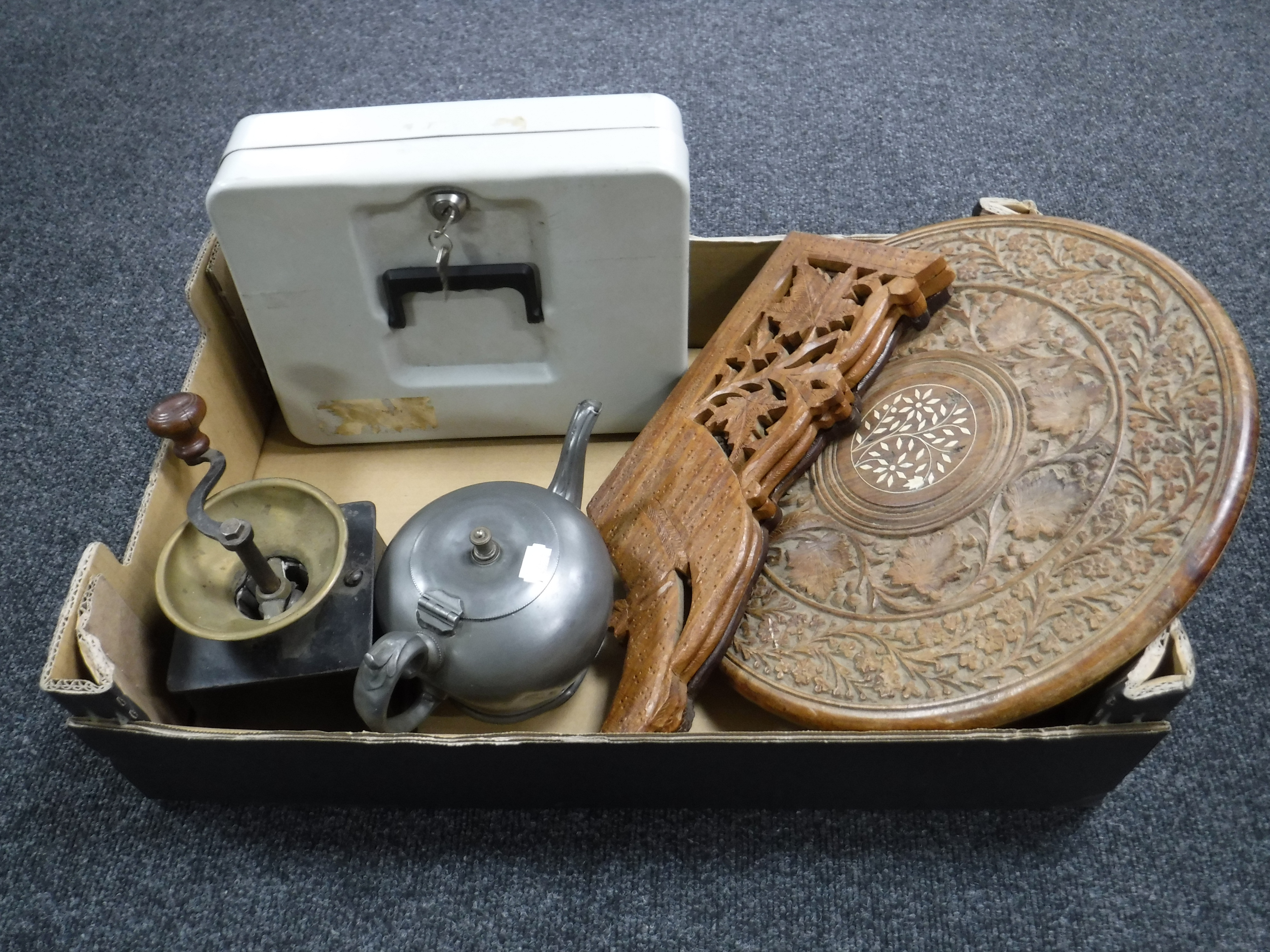 A box containing an Eastern occasional table, a metal cash box with key,