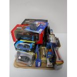 A tray containing boxed die cast vehicles, Burago, Matchbox,