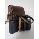 A set of leather cased Carl Zeiss Jenoptem 8x30 binoculars