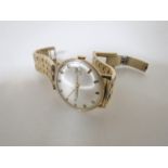 A Gents 9ct gold Accurist wristwatch on plated strap