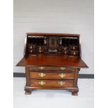 A child's Georgian style mahogany bureau