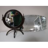 A circular mahogany dressing table mirror,