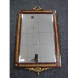 A mahogany and gilt framed bevel edged mirror with brass mounts