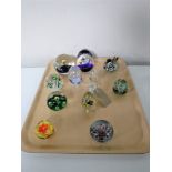 A collection of eleven glass paperweights