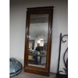 A continental walnut framed hall mirror