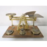 A set of brass postal scales