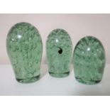 A set of three Victorian green glass dumps