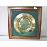 A framed brass Masonic plaque