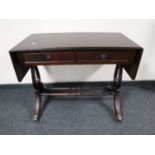 An inlaid mahogany sofa table fitted two drawers