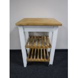 A pine topped butchers block trolley