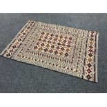 An Eastern carpet with geometric design,