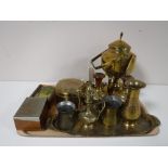A tray containing assorted brass ware including a spirit kettle on stand, measures,