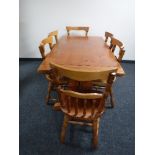 A pine refectory kitchen table and six chairs