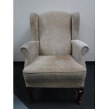 A wing back armchair