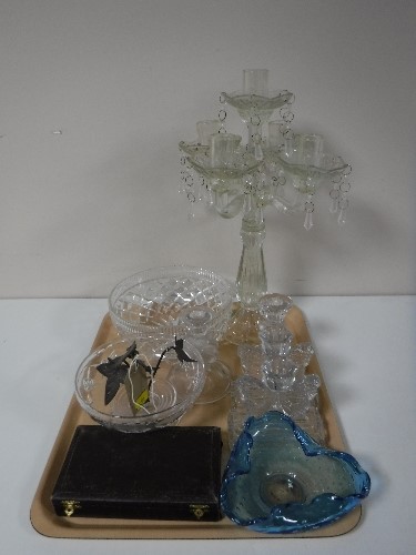 A tray containing assorted glassware, including a five way table candelabra with glass drops,