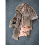 A fur coat and fur stole