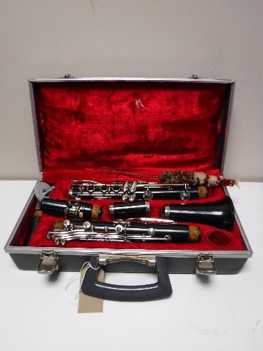 A five piece Boosey and Hawkes clarinet in case with extra mouth piece,