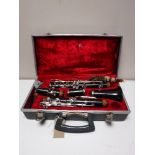 A five piece Boosey and Hawkes clarinet in case with extra mouth piece,