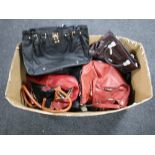 A box containing a quantity of lady's leather handbags