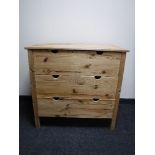 A pine three drawer chest