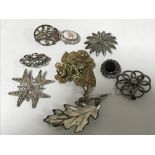 Ten silver brooches (10)