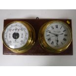 A brass ships style barometer and clock,